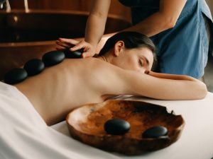 Woman receiving a relaxing hot stone massage at The Spa at Terranea Resort at Rancho Palos Verdes, California 