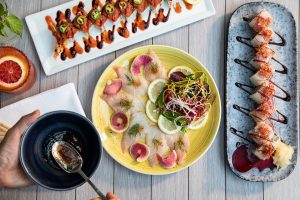 Colorful sushi rolls and sashimi platter at Bashi, Terranea Resort in Rancho Palos Verdes, featuring vibrant seafood, citrus cocktails, and artistic plating.