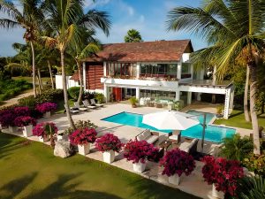 Luxury Caribbean villa with five bedrooms, five bathrooms, open-plan living spaces, expansive outdoor areas, private pool, and Jacuzzi — ideal for families or groups seeking comfort and relaxation.