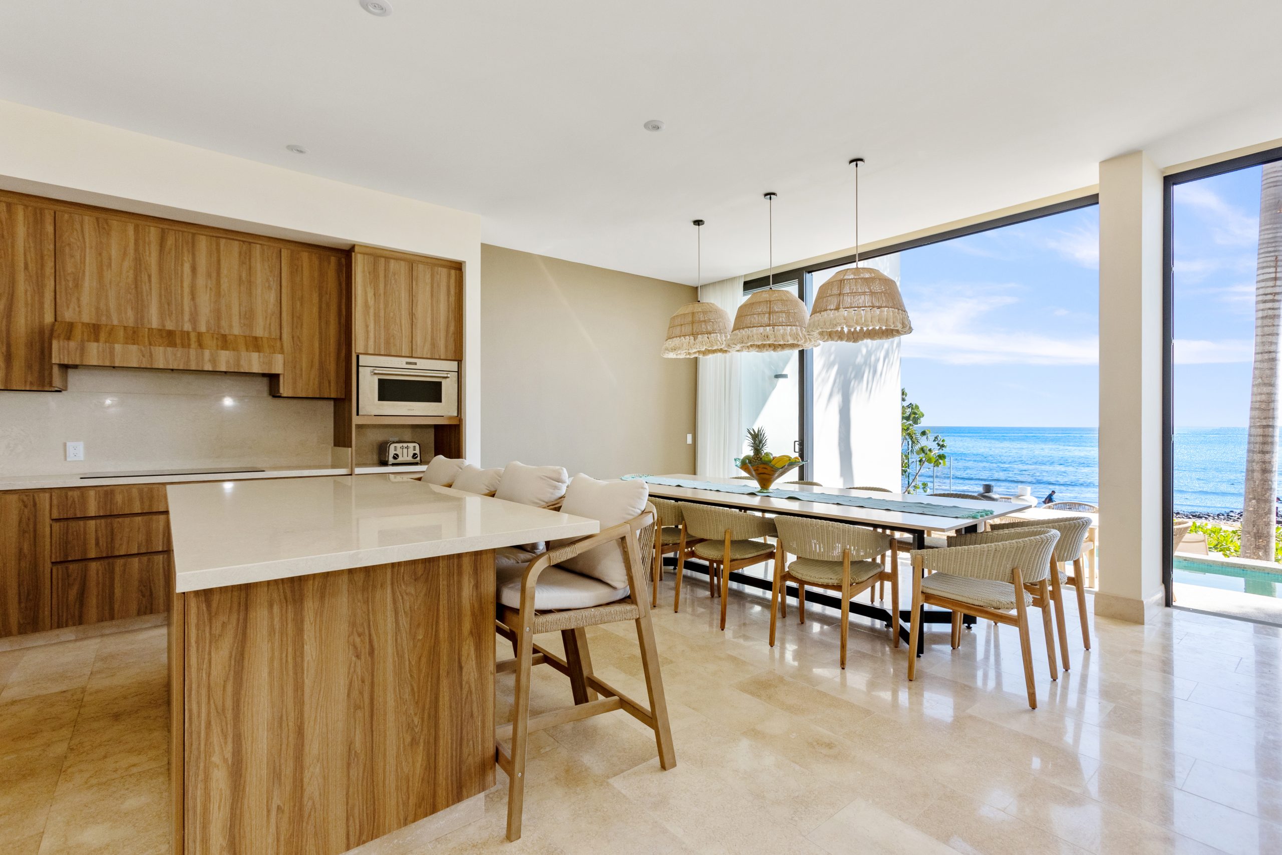 Modern luxury villa in Nuevo Vallarta, Mexico featuring contemporary architecture, private pool, and tropical garden views near the beach.