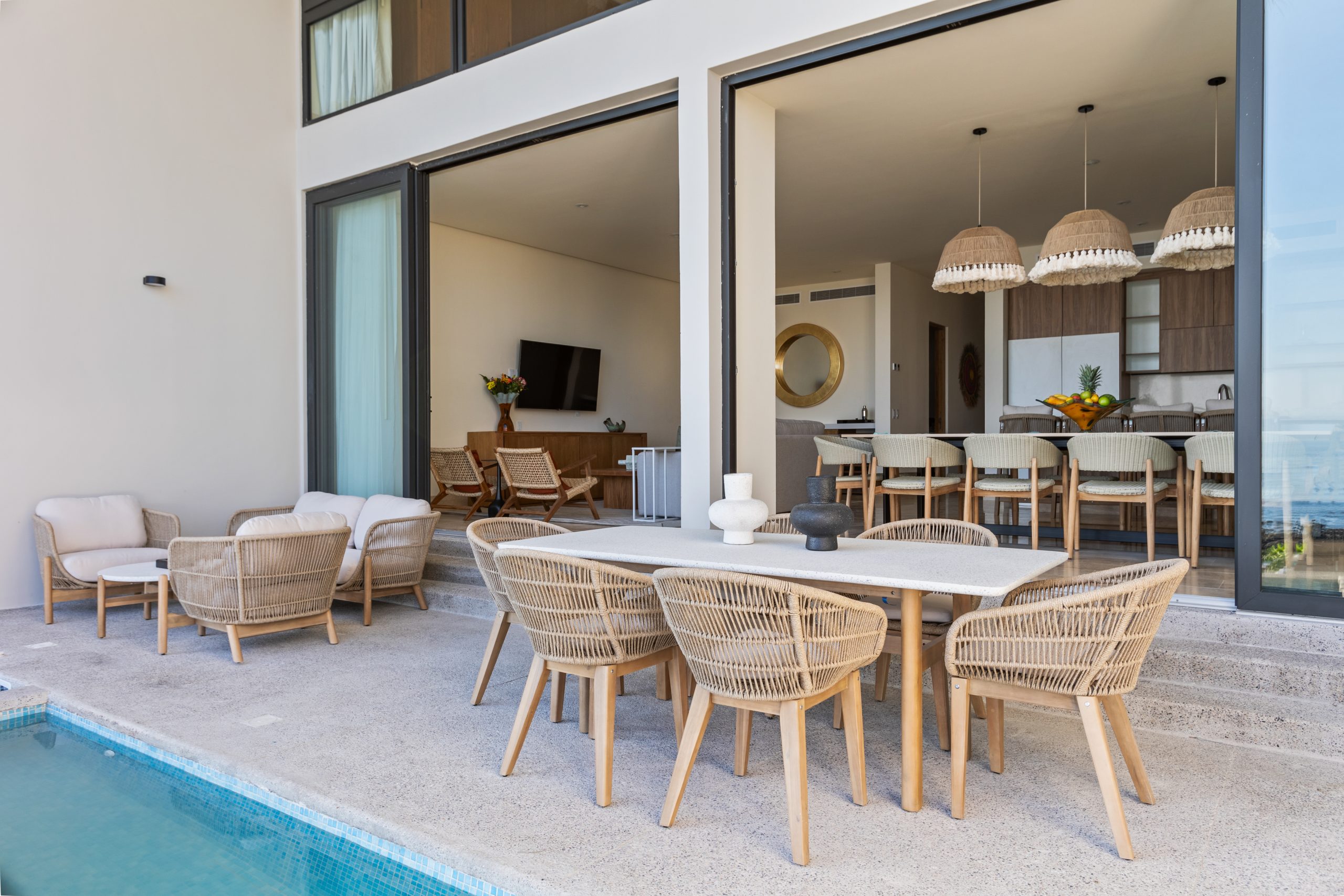 Modern luxury villa in Nuevo Vallarta, Mexico featuring contemporary architecture, private pool, and tropical garden views near the beach.