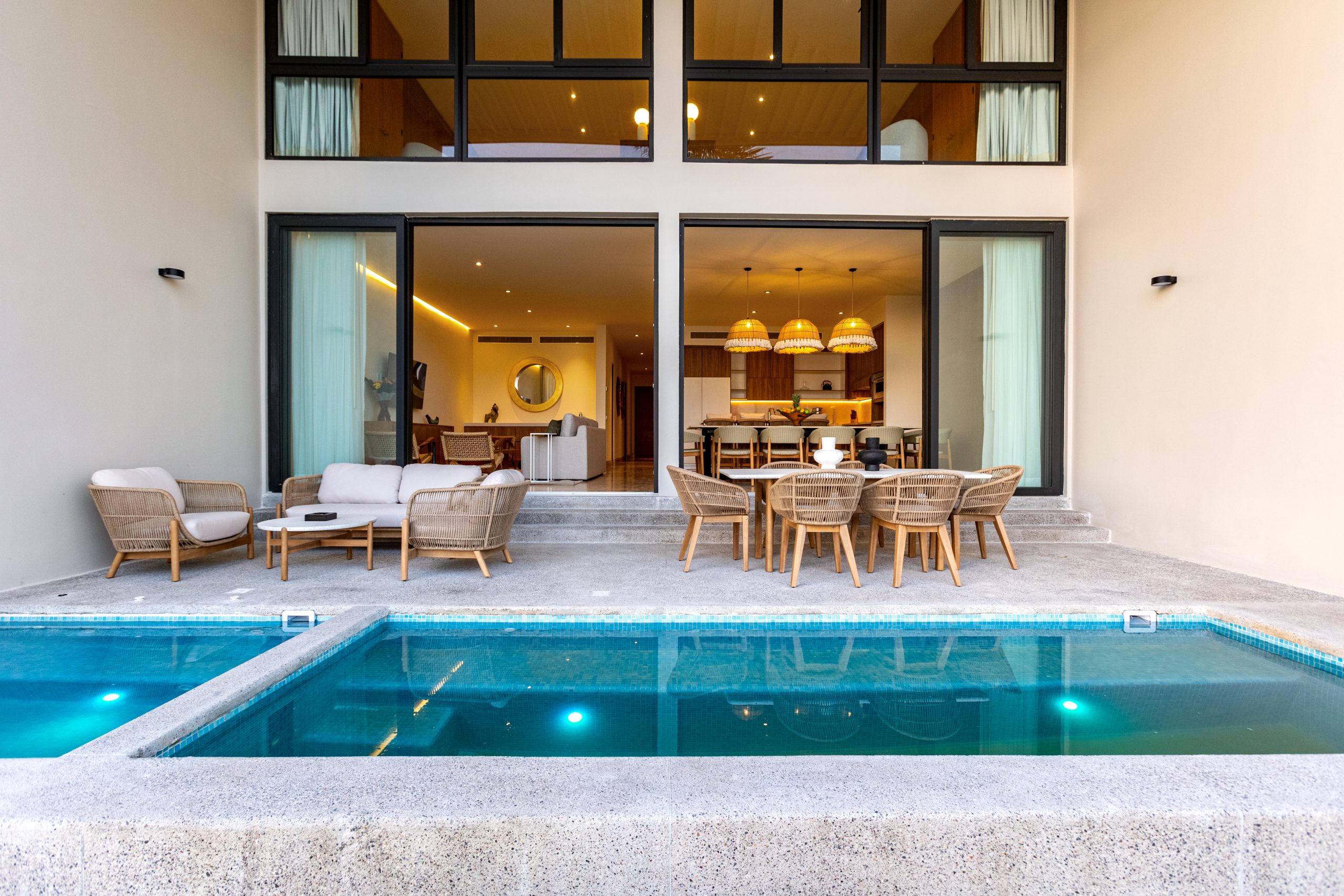 Modern luxury villa in Nuevo Vallarta, Mexico featuring contemporary architecture, private pool, and tropical garden views near the beach.