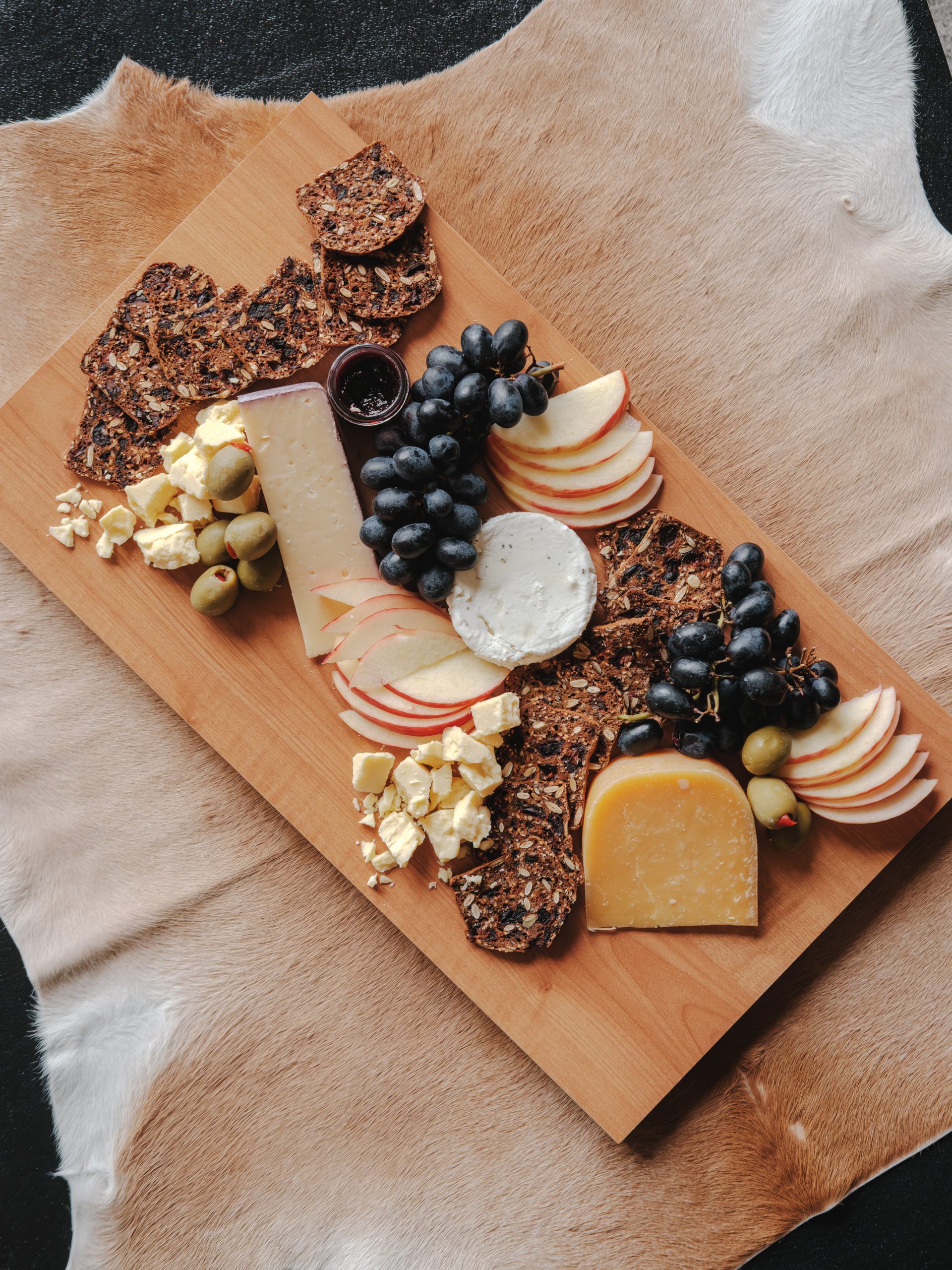 charcuterie board in a cozy living space in Big Sky Resort, Montana