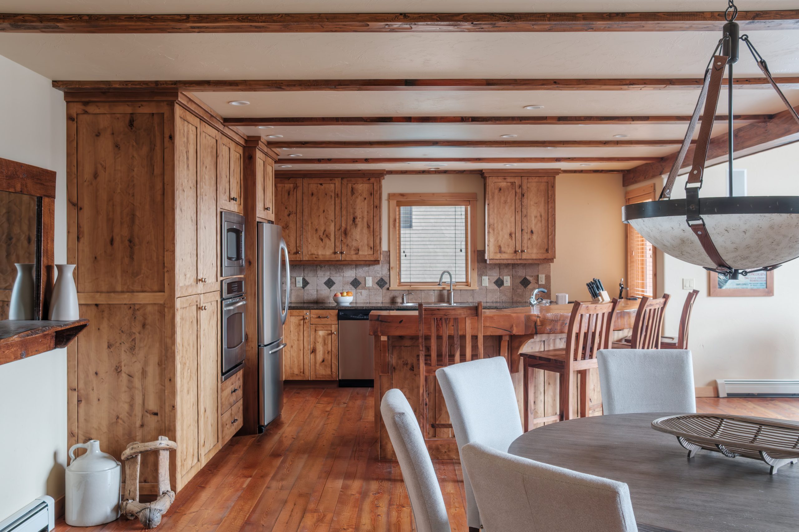 Luxury kitchen in Big Sky Resort home with wooden countertops and large island.