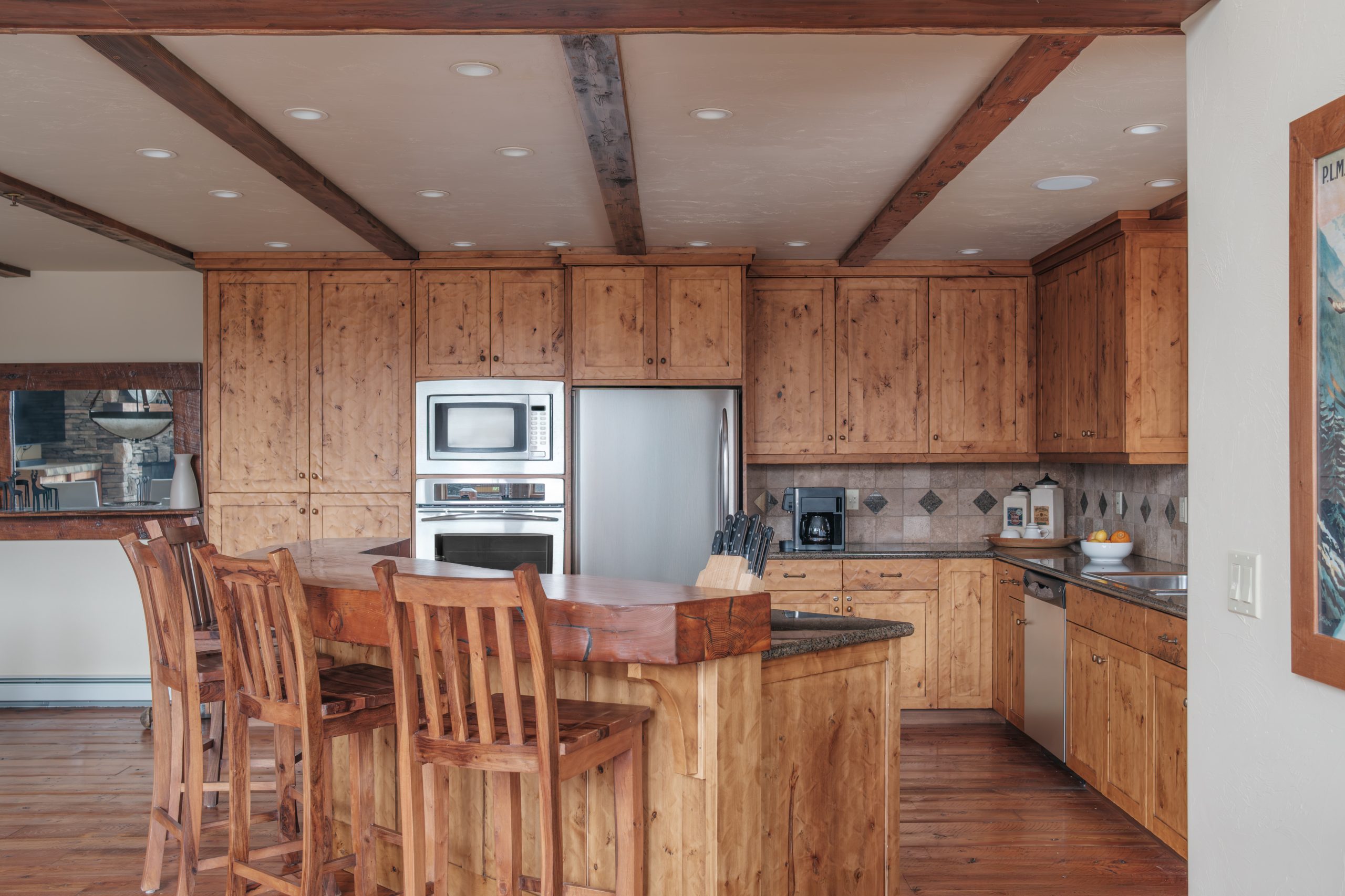 Luxury kitchen in Big Sky Resort home with wooden countertops and large island.