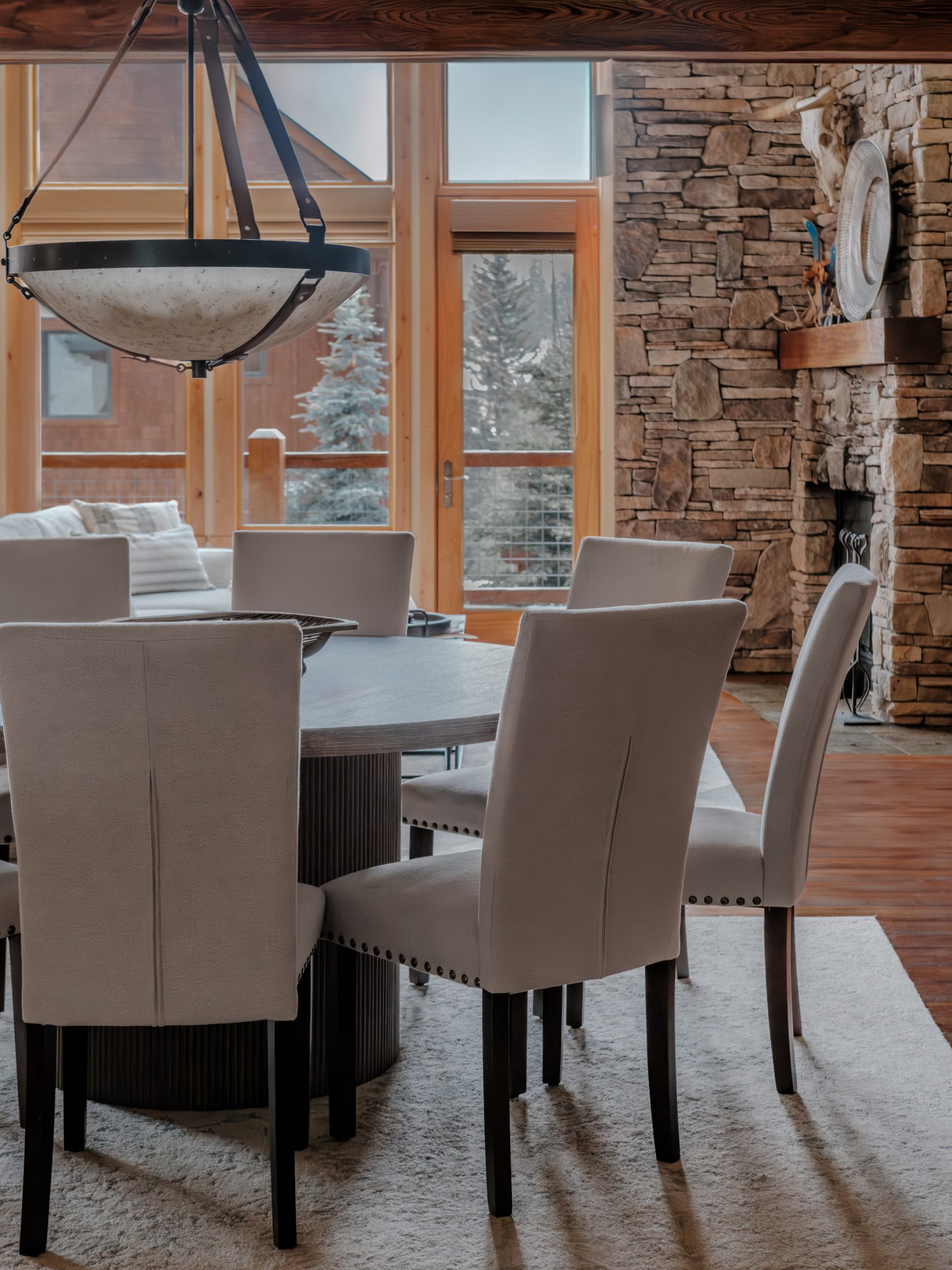 Elegant dining area with mountain views in Big Sky luxury property.
