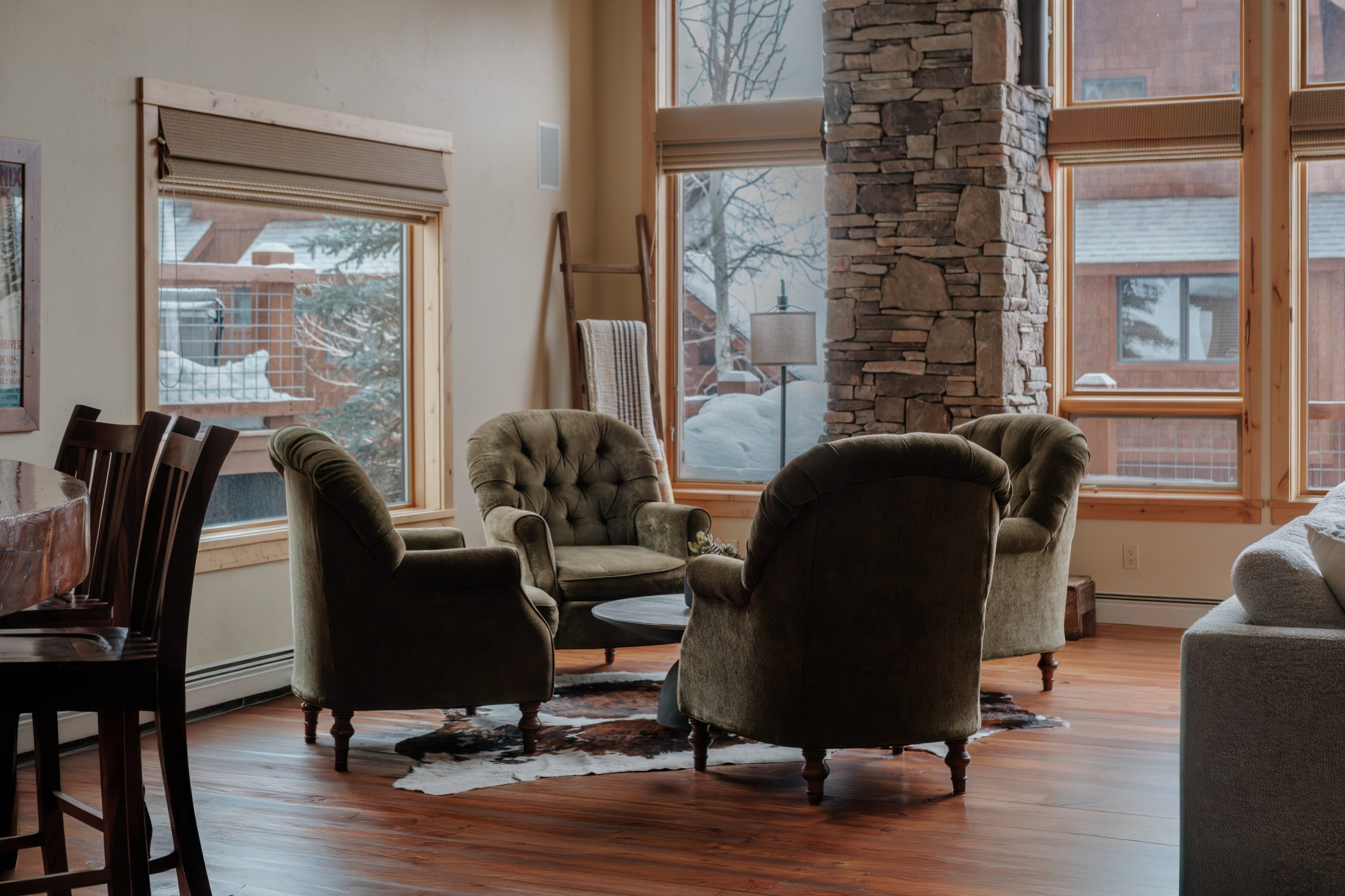 High-end mountain home living room with dramatic vaulted ceilings in Big Sky Resort, Montana