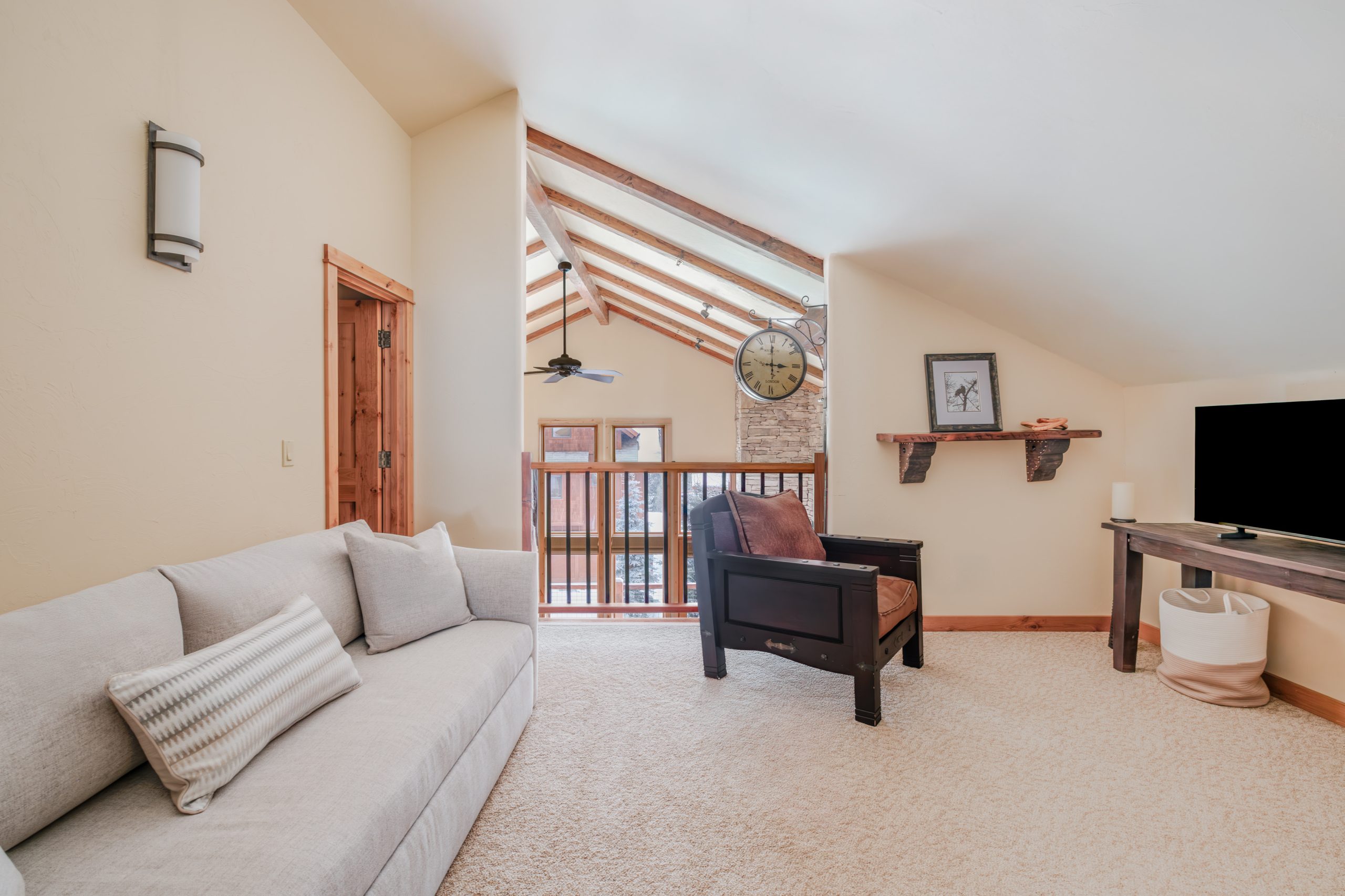 Luxury Mountain home in Big Sky Resort featuring vaulted ceilings and cozy interiors for a relaxing vacation with your family and friends