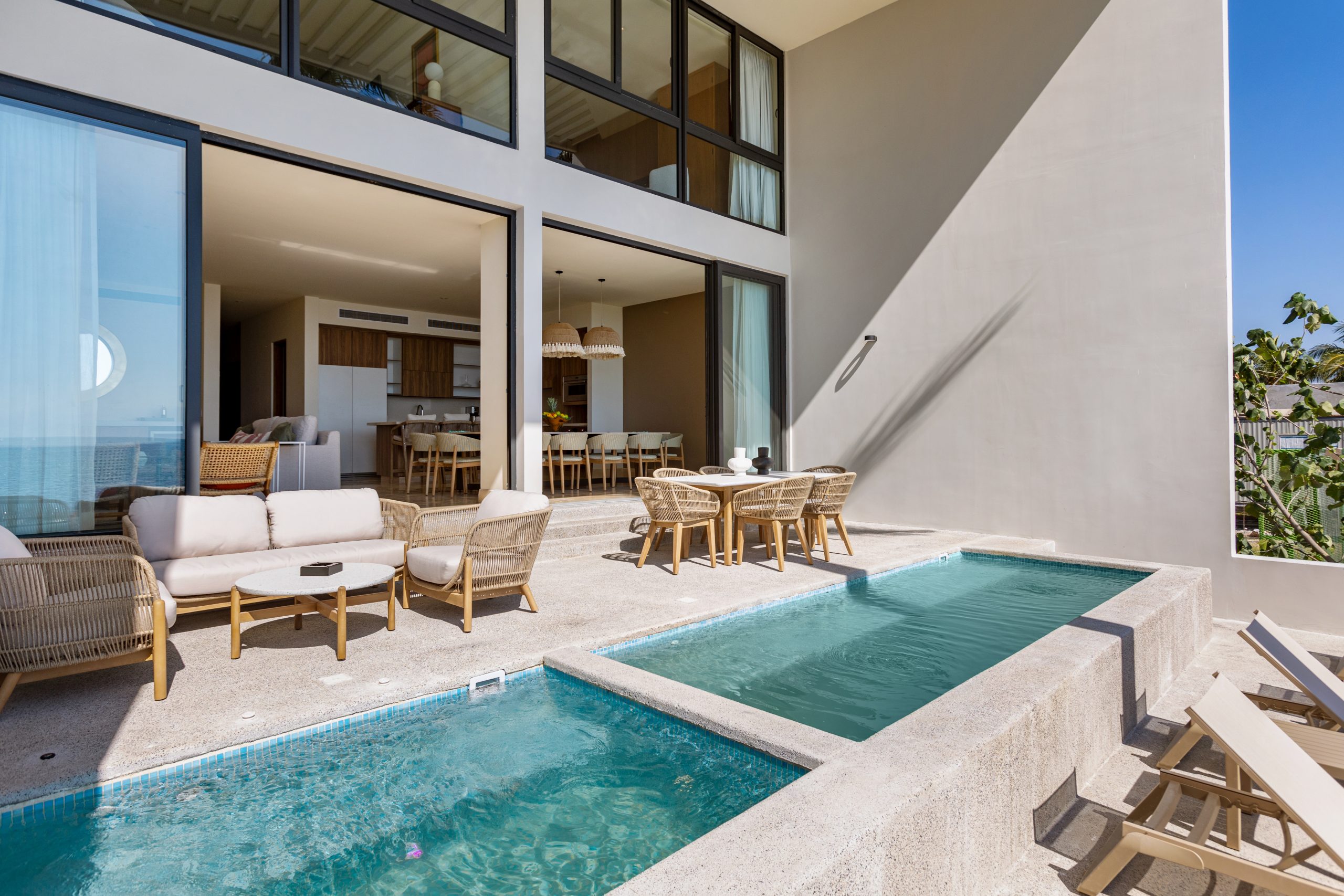 Bright oceanfront dining and living area in a luxury Nuevo Vallarta vacation villa.