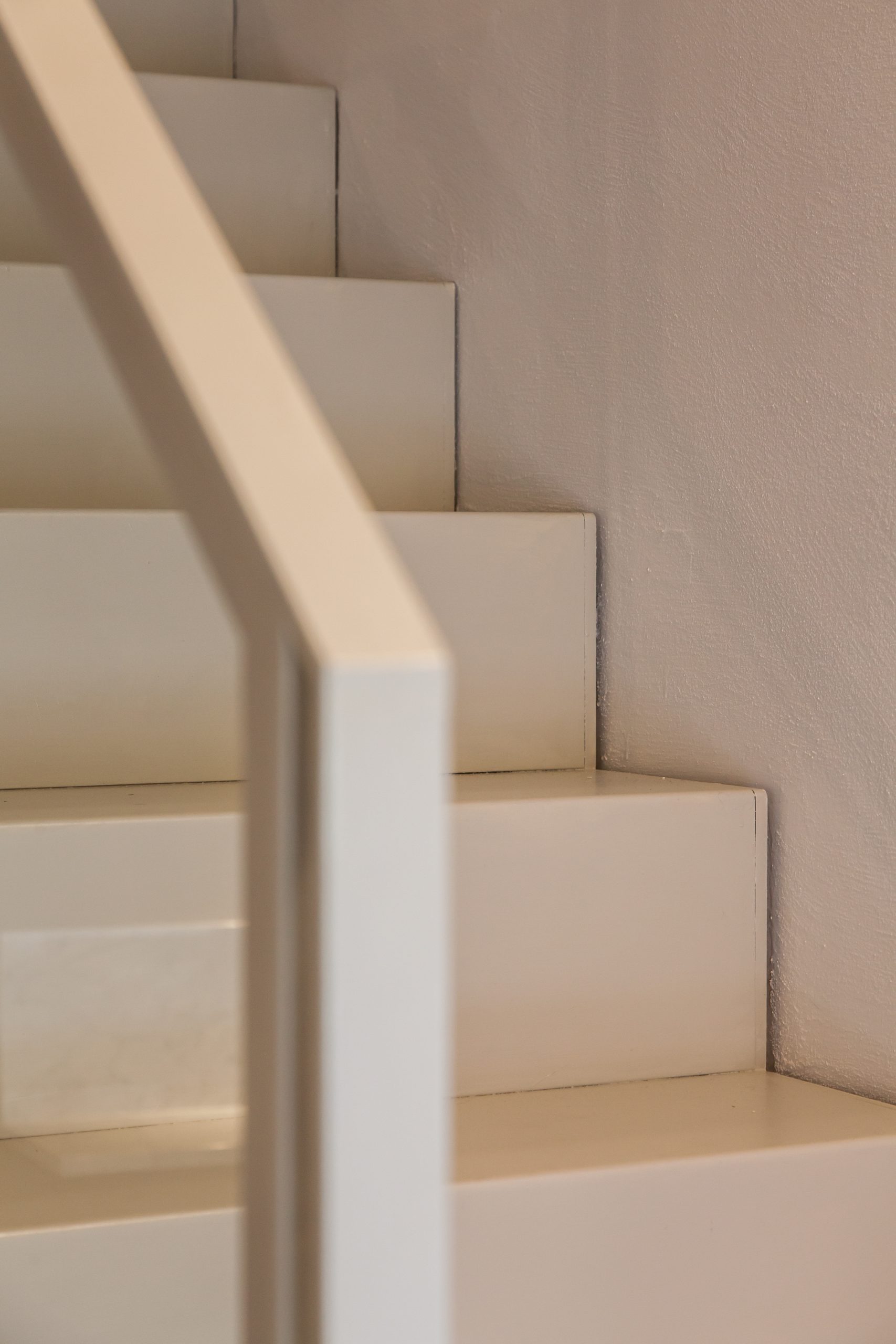 Modern White Stairs in a Luxury Penthouse in Siena