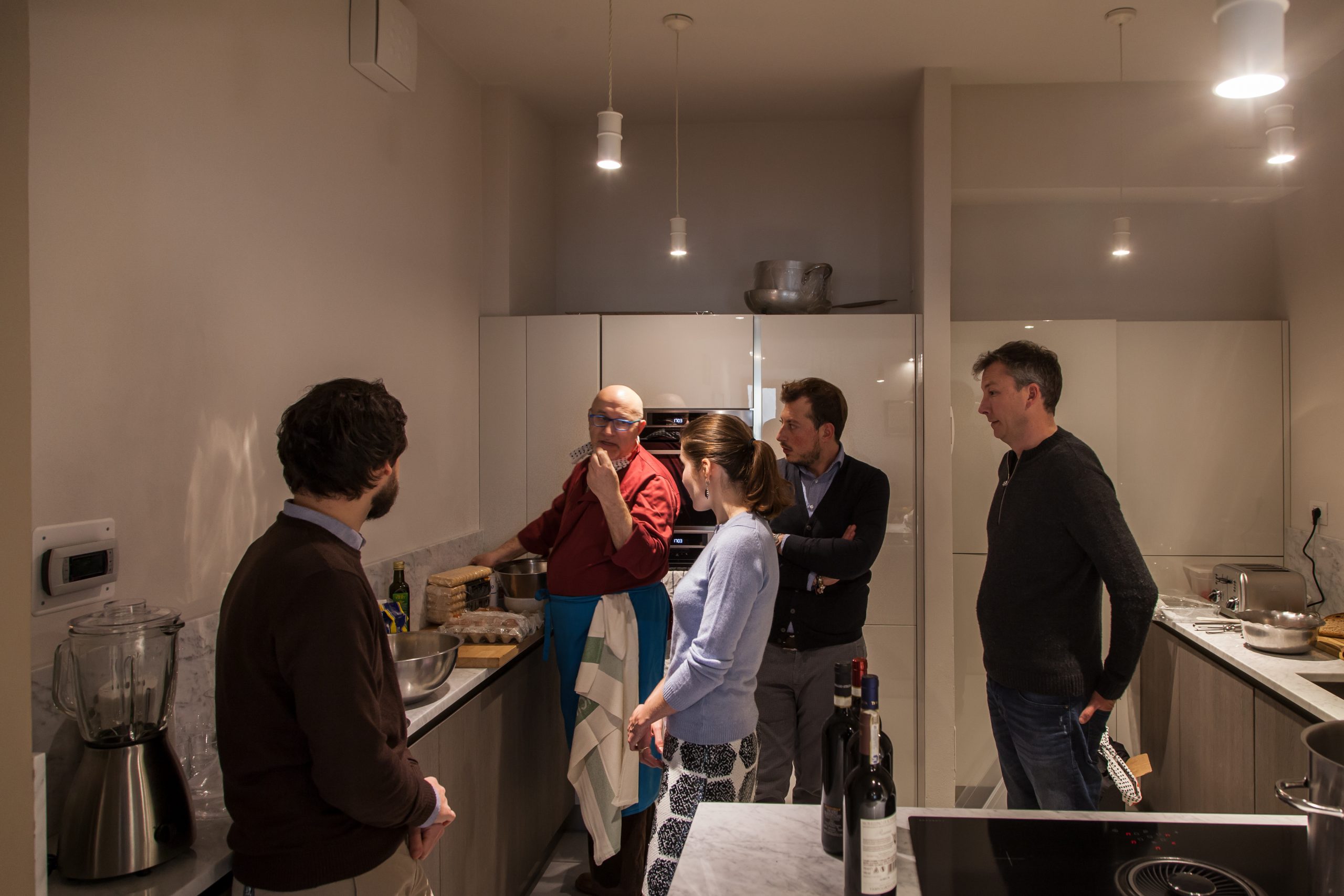 People Gathering for an Exclusive Wine Tasting with a Private Chef in a Luxury Penthouse in Siena, Italy