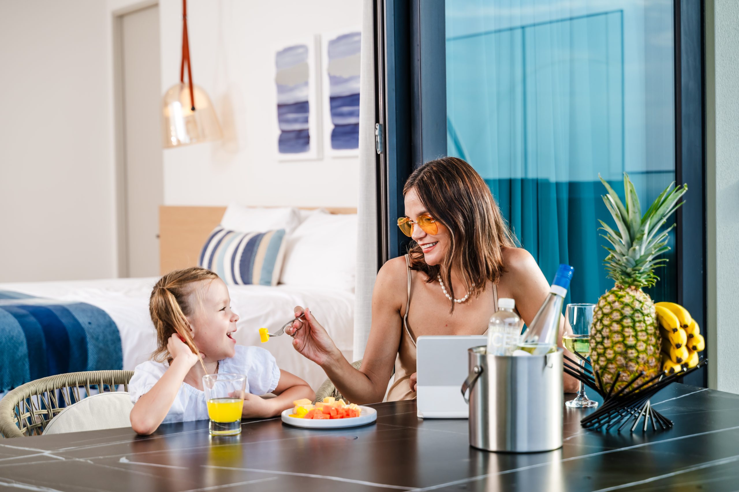 Mom and Daughter Eating Breakfast at the Solaris Reserva Conchal Penthouse Terrace in Costa Rica