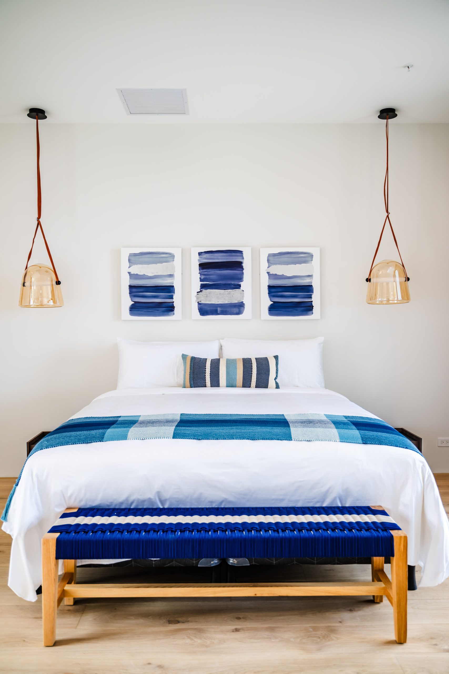 Reserva Conchal Bedroom with Blue Wall Art Decoration