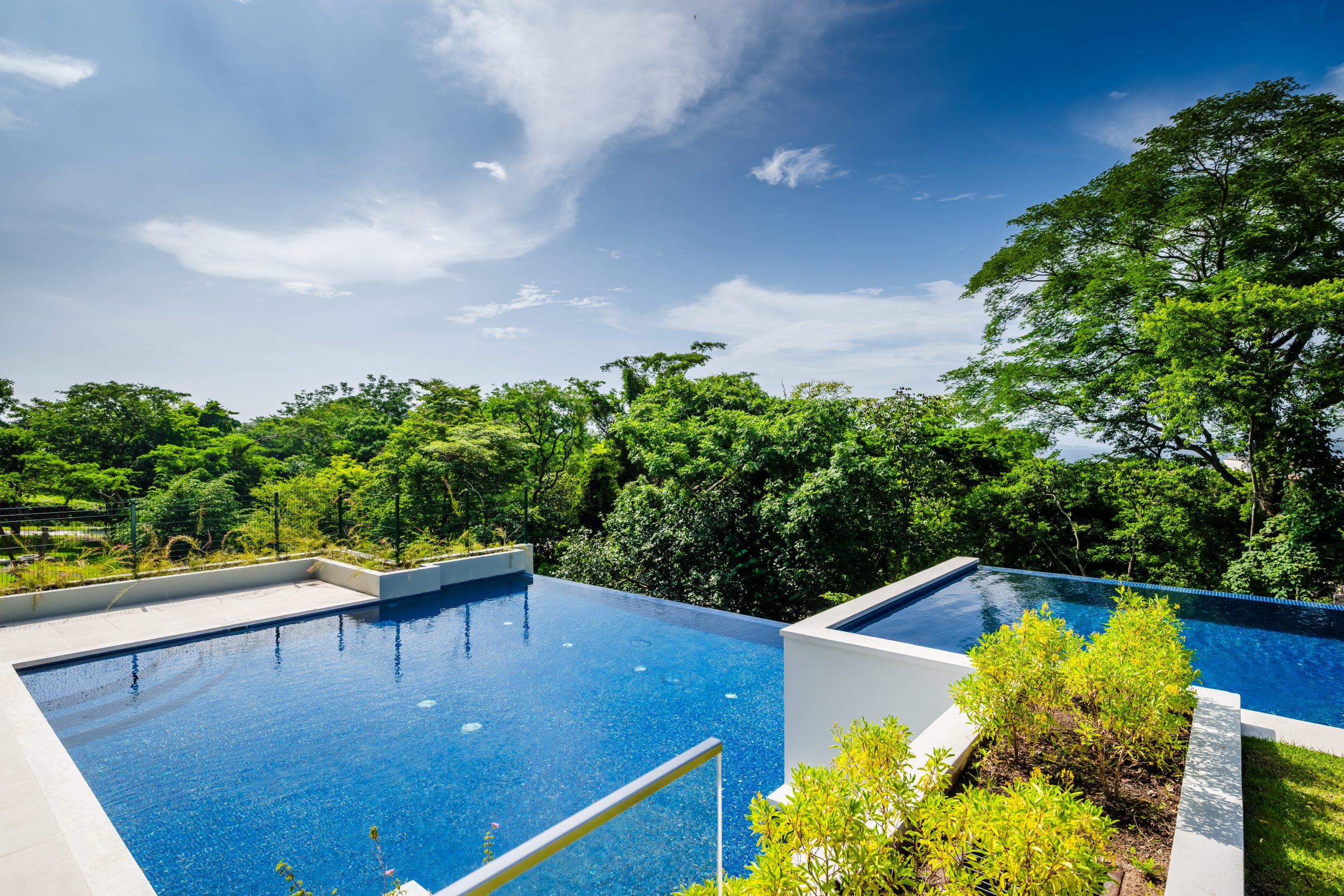 Reserva Conchal Pool Area with Jungle and Ocean Views