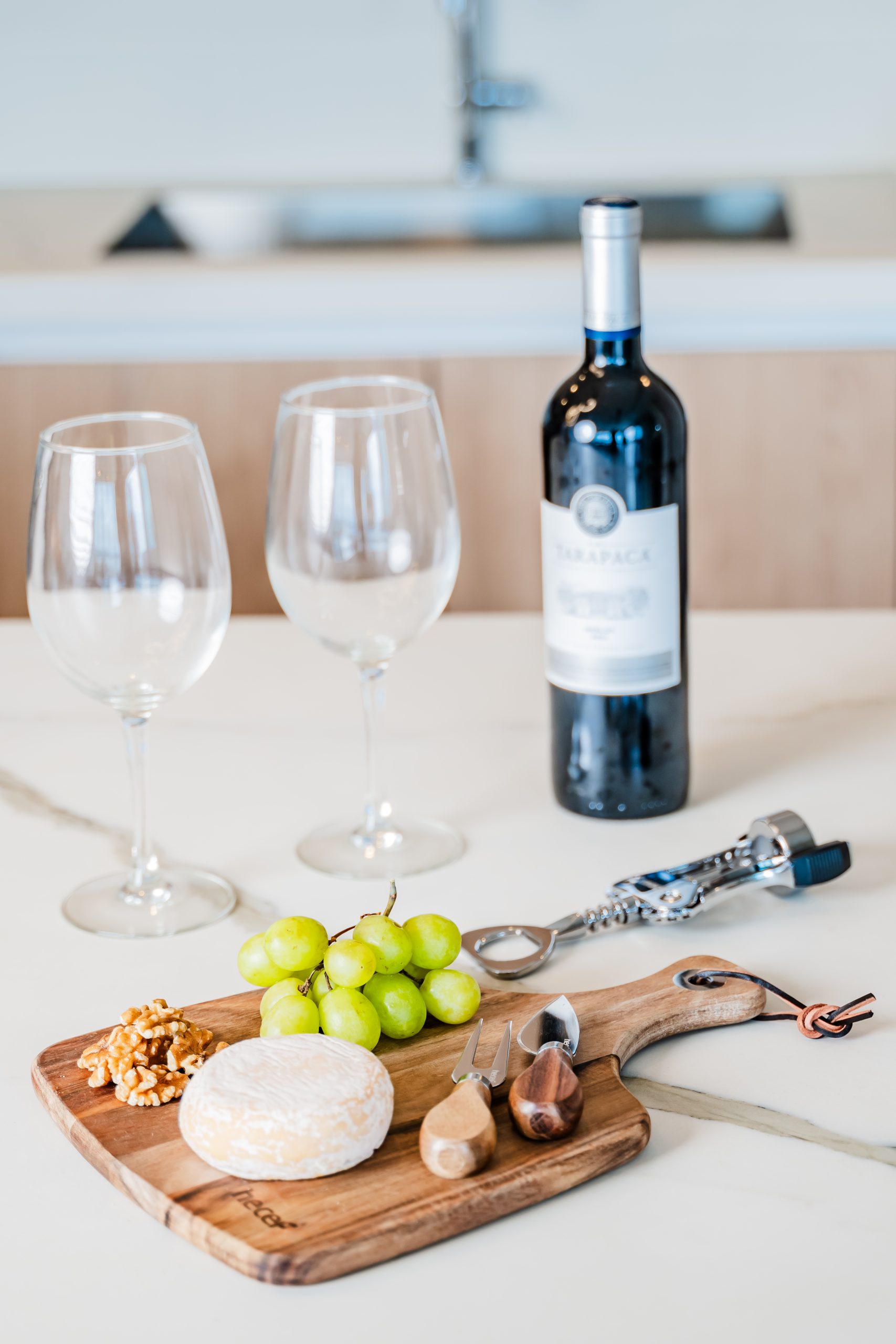 Luxury Dining Setting with Two Wine Glass and a Bottle of Wine at Solaris Reserva Conchal Penthouse in Costa Rica