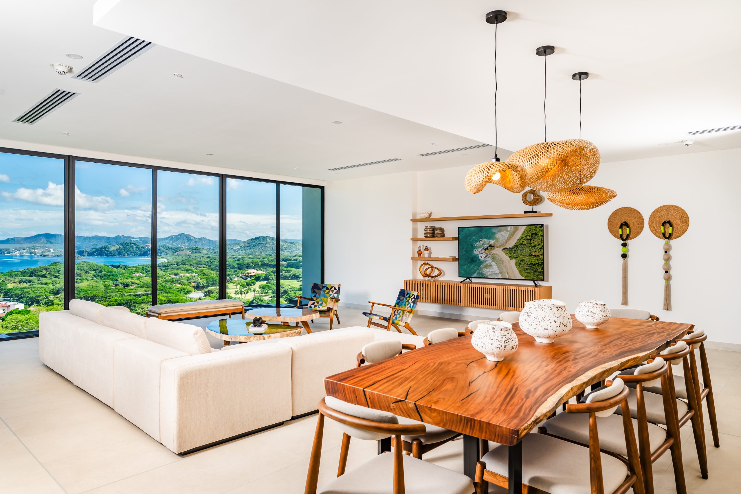 Luxury Modern Living Room and Dining Room with Floor to Window Ocean View at Solaris Reserva Conchal Penthouse Costa Rica