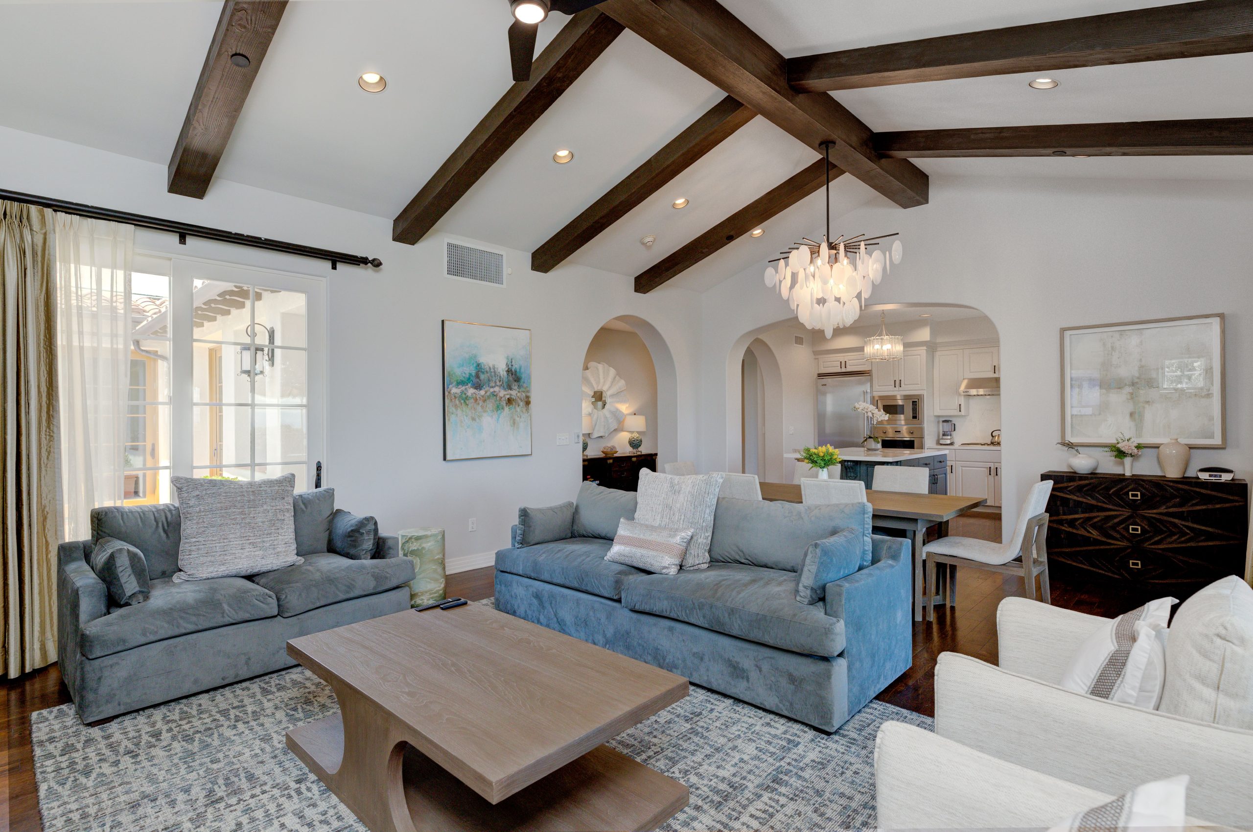 Terranea Resort villa living room and dining area with ocean‑view windows