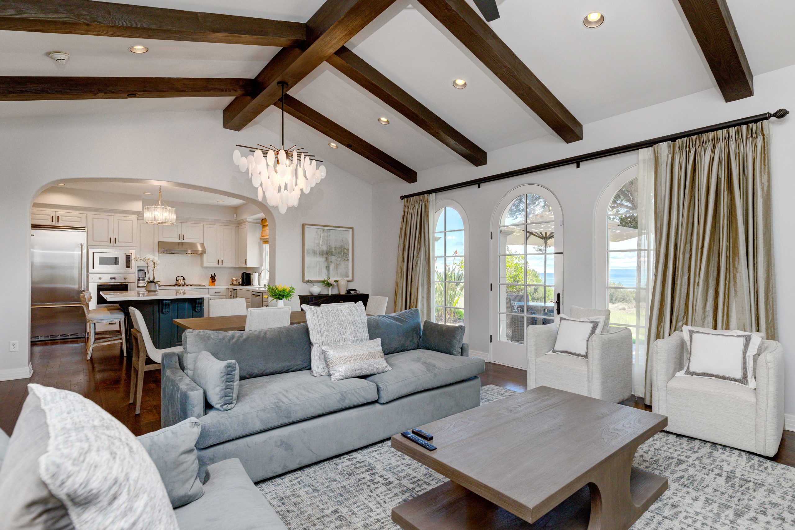 Terranea Resort villa living room and dining area with ocean‑view windows