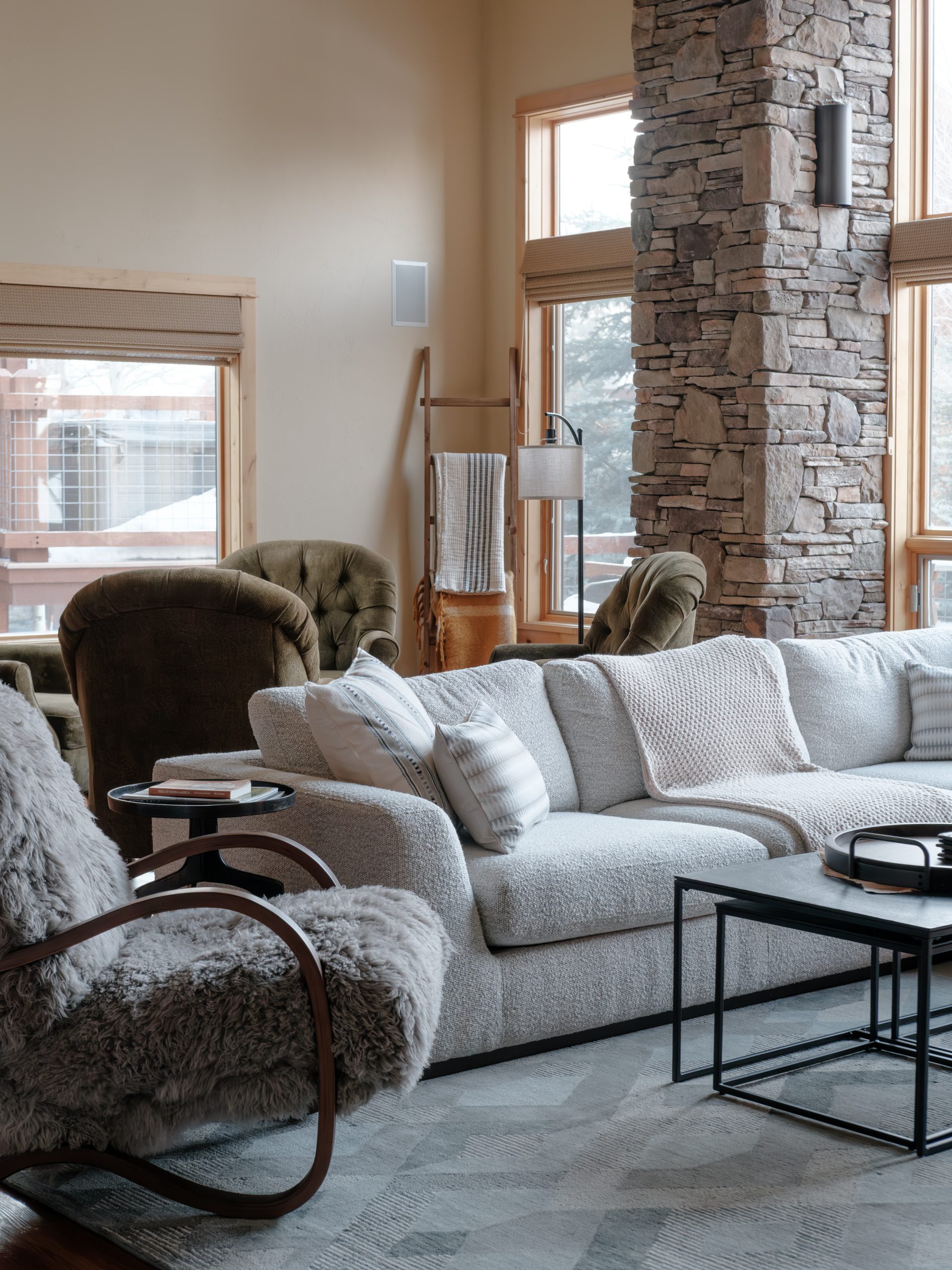 Big Sky Montana mountain home living room featuring a cozy fireplace.