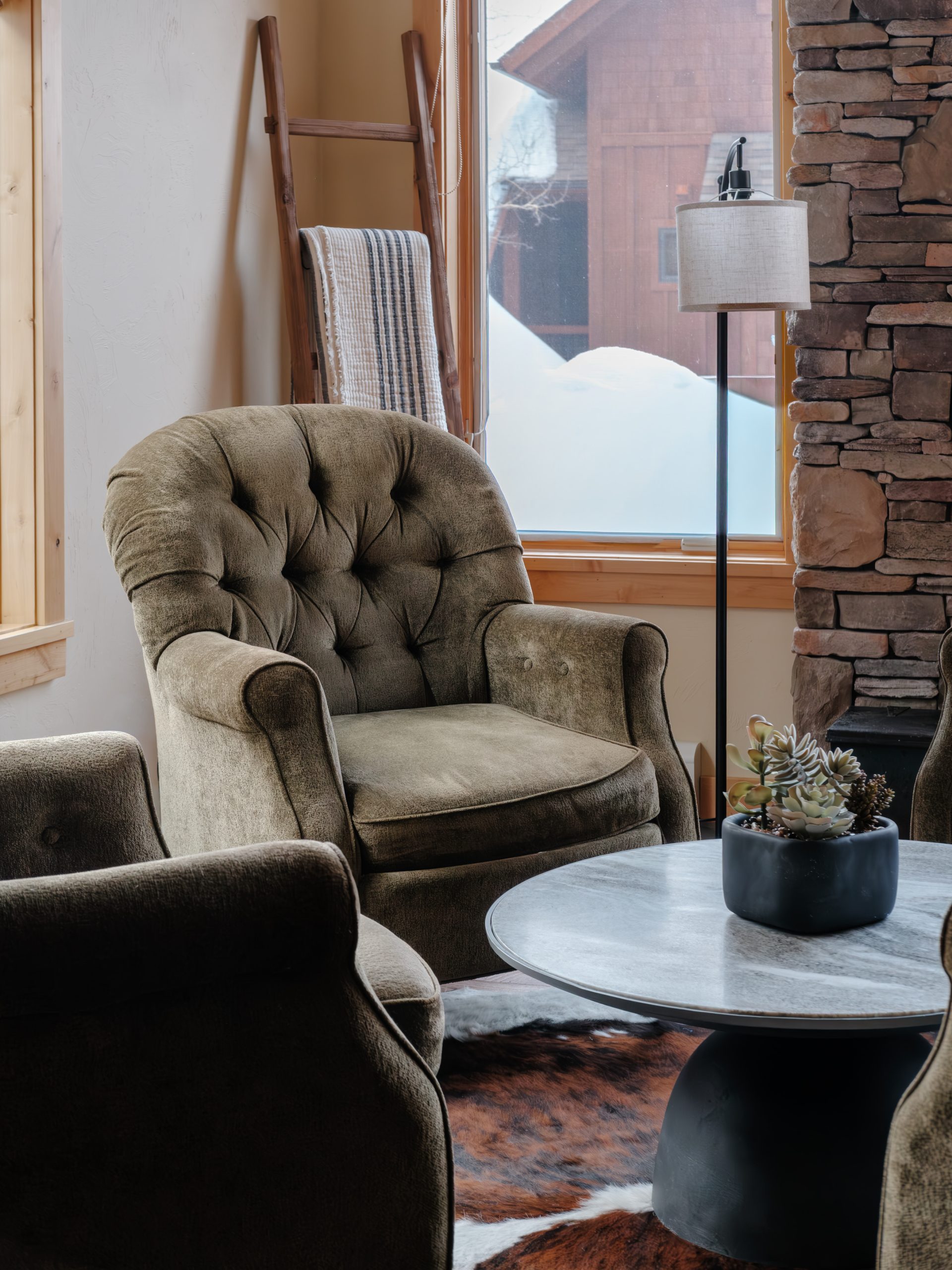 Luxury living space with vaulted timber ceilings and mountain views in Big Sky.