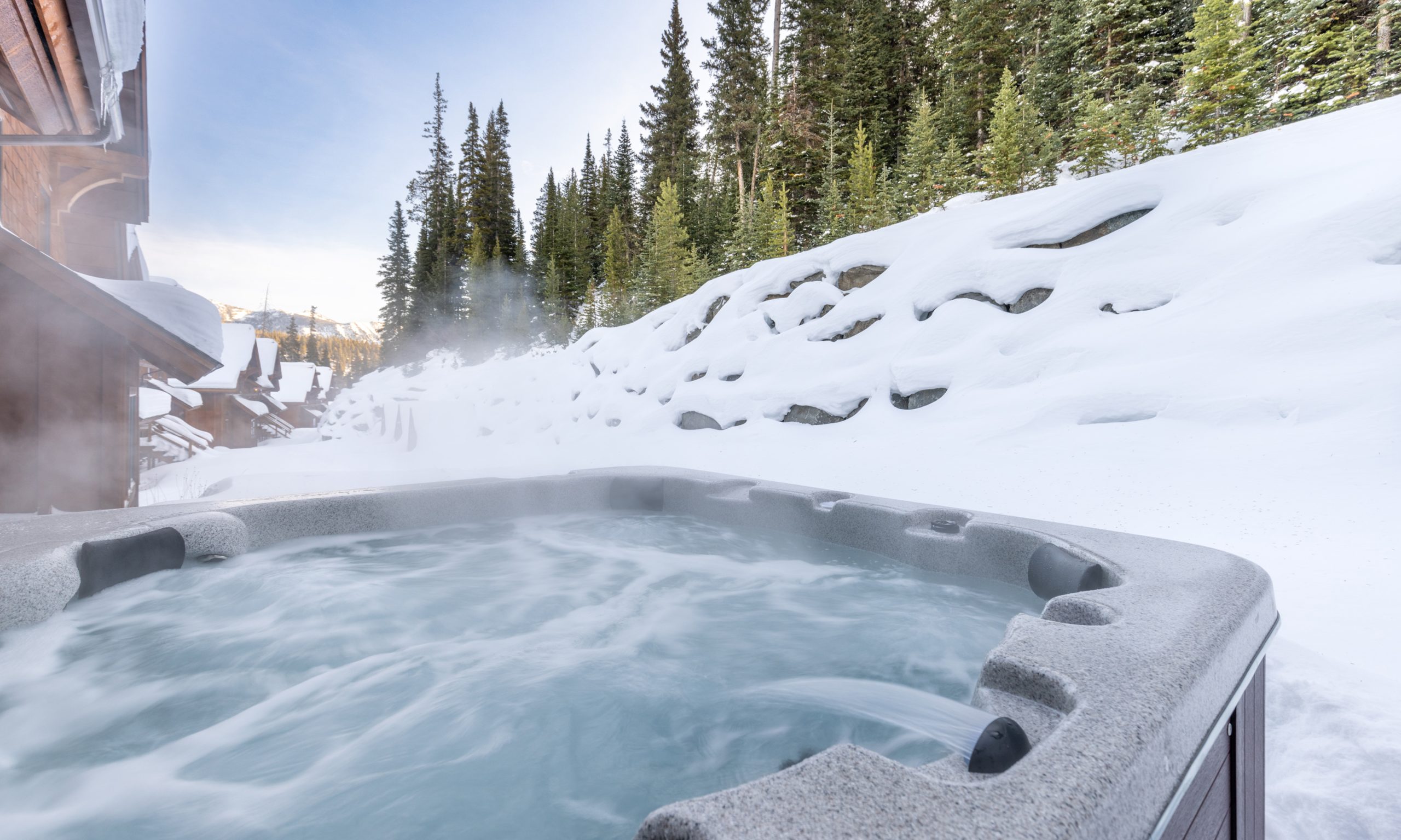 Luxury Big Sky Resort mountain home with outdoor hot tub and ski-in:ski-out access