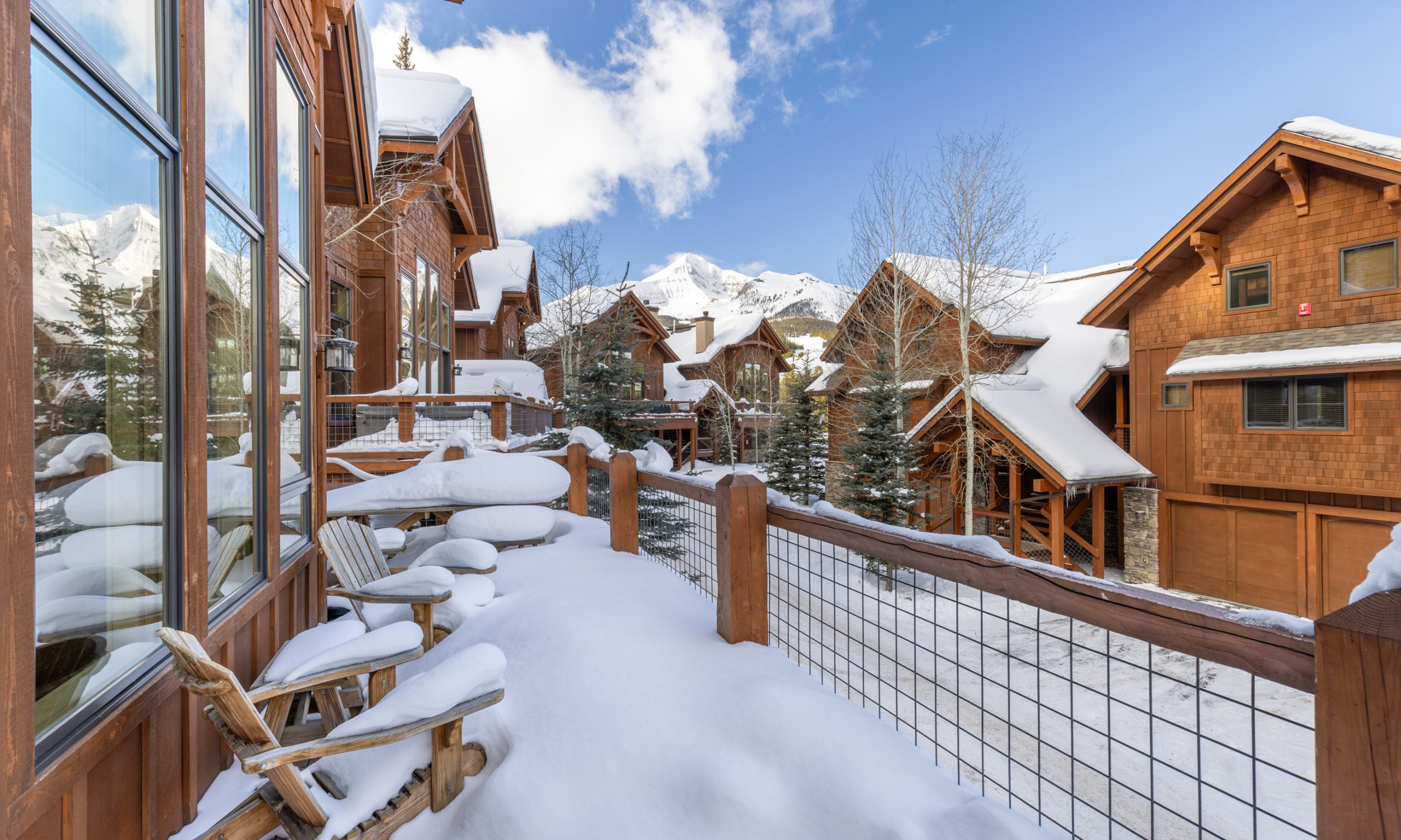 Snow-covered luxury lodge at Big Sky Resort with ski-in:ski-out access to the slopes