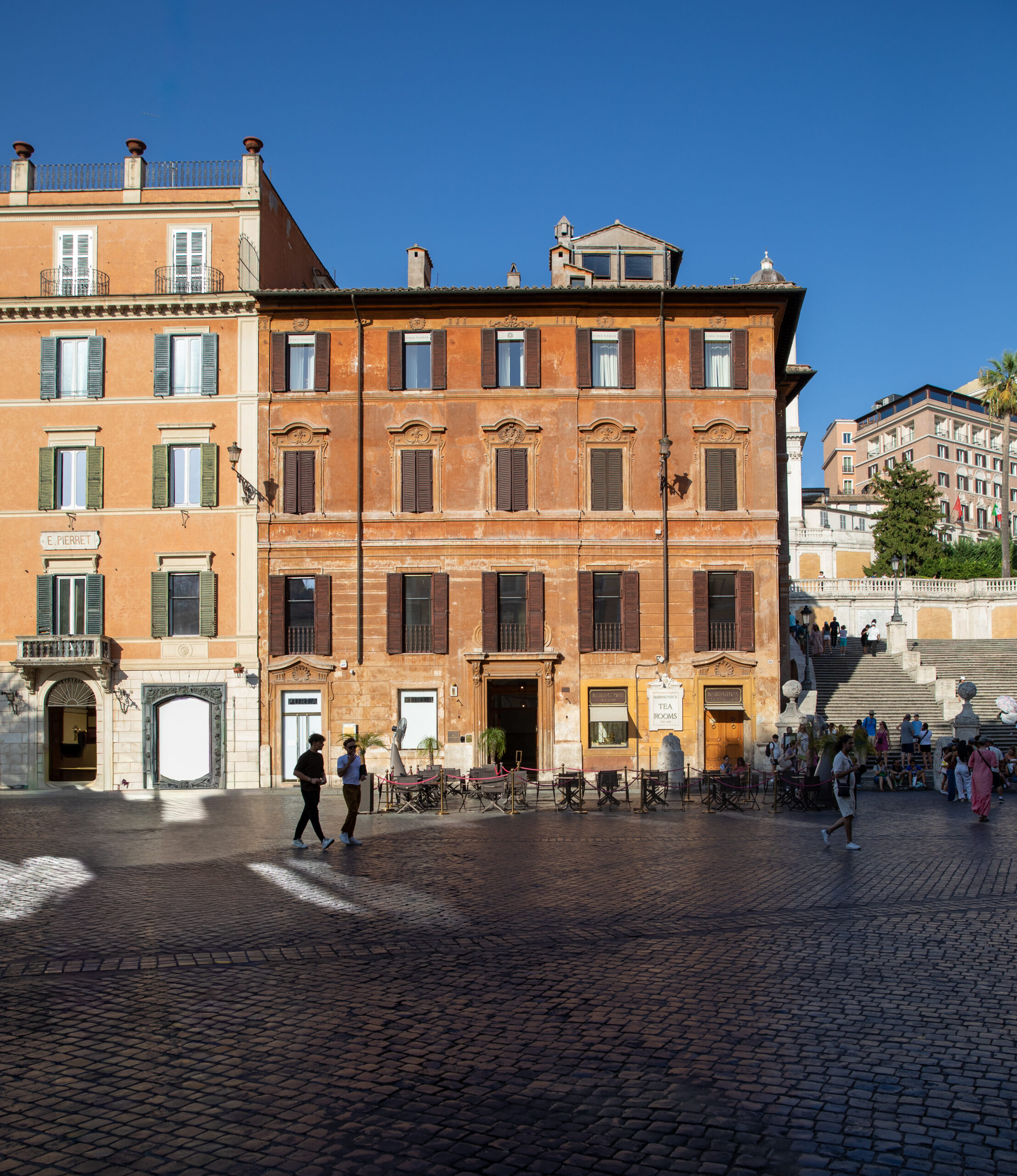 Charming Rome street with restaurants and historic architecture near the Spanish Steps_