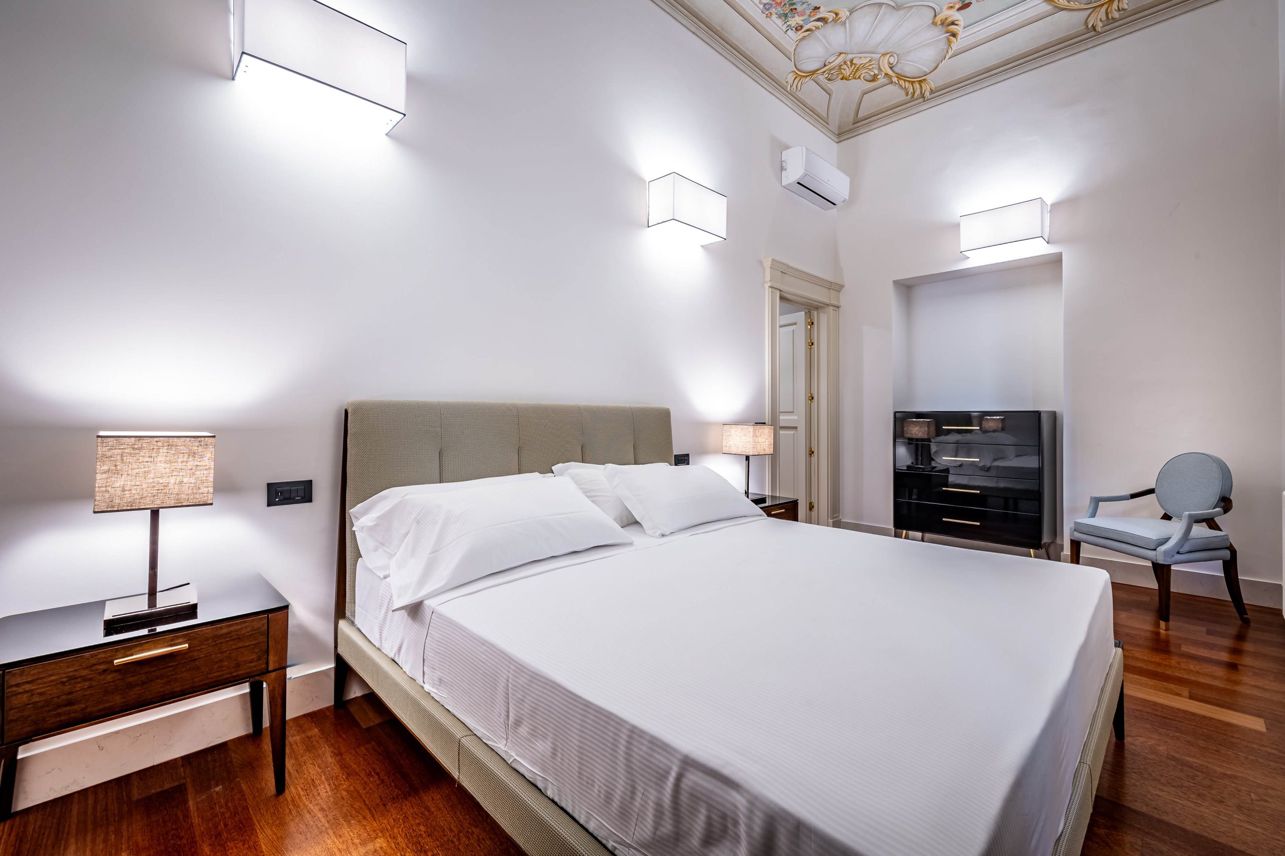 Comfortable king bed with soft linens in a luxury apartment in Florence with Duomo view