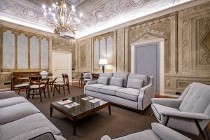 Elegant living room with sofa seating in a luxury apartment in Florence with Duomo view