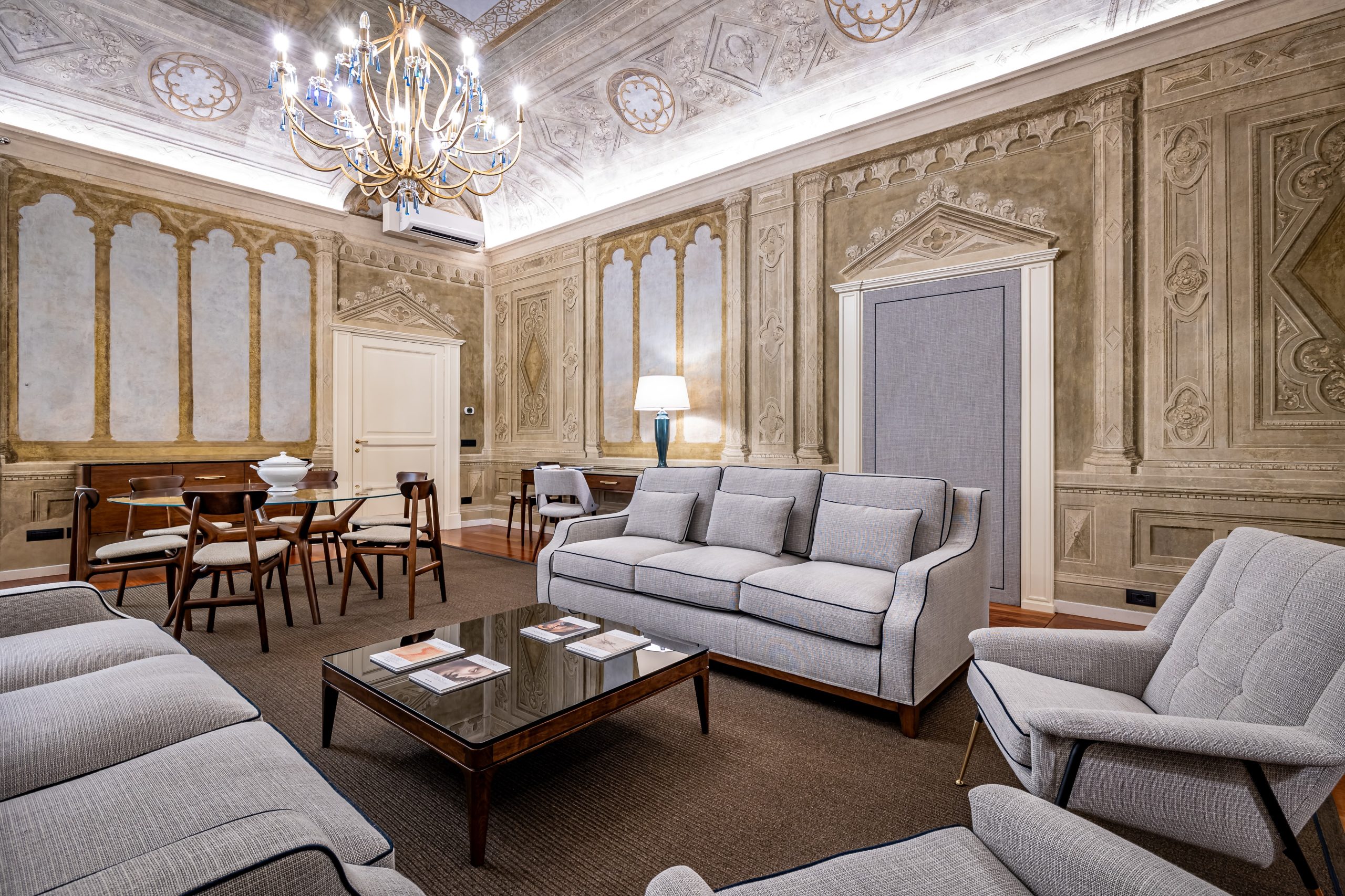 Elegant living room with sofa seating in a luxury apartment in Florence with Duomo view