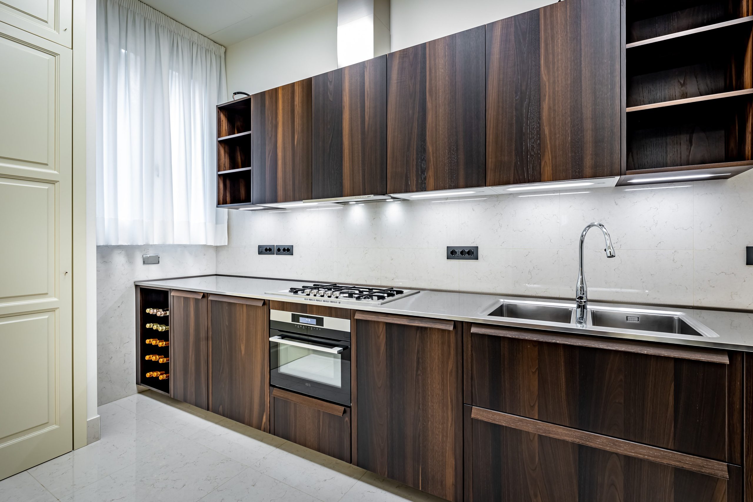 Contemporary kitchen with stove and oven in a luxury apartment in Florence with Duomo view