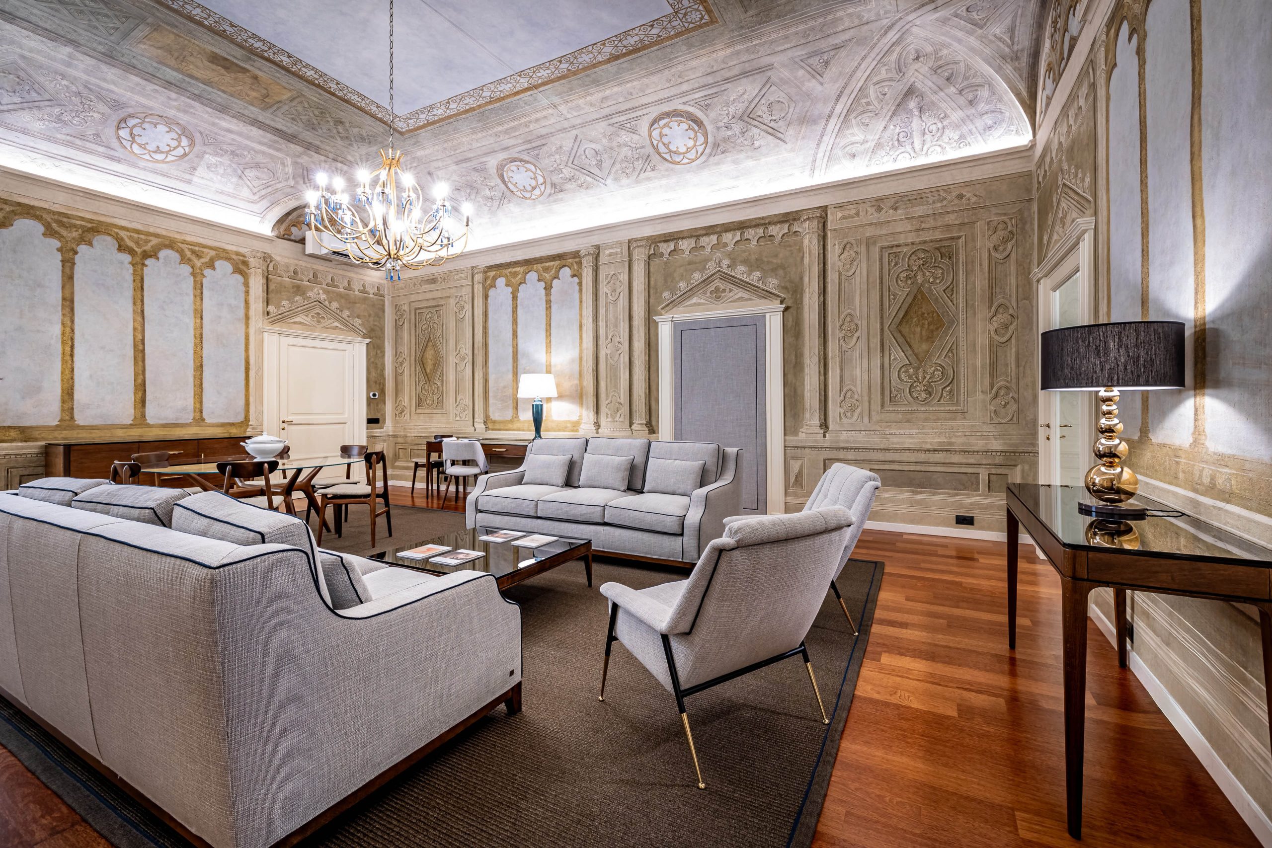 Elegant living room with sofa seating in a luxury apartment in Florence with Duomo view