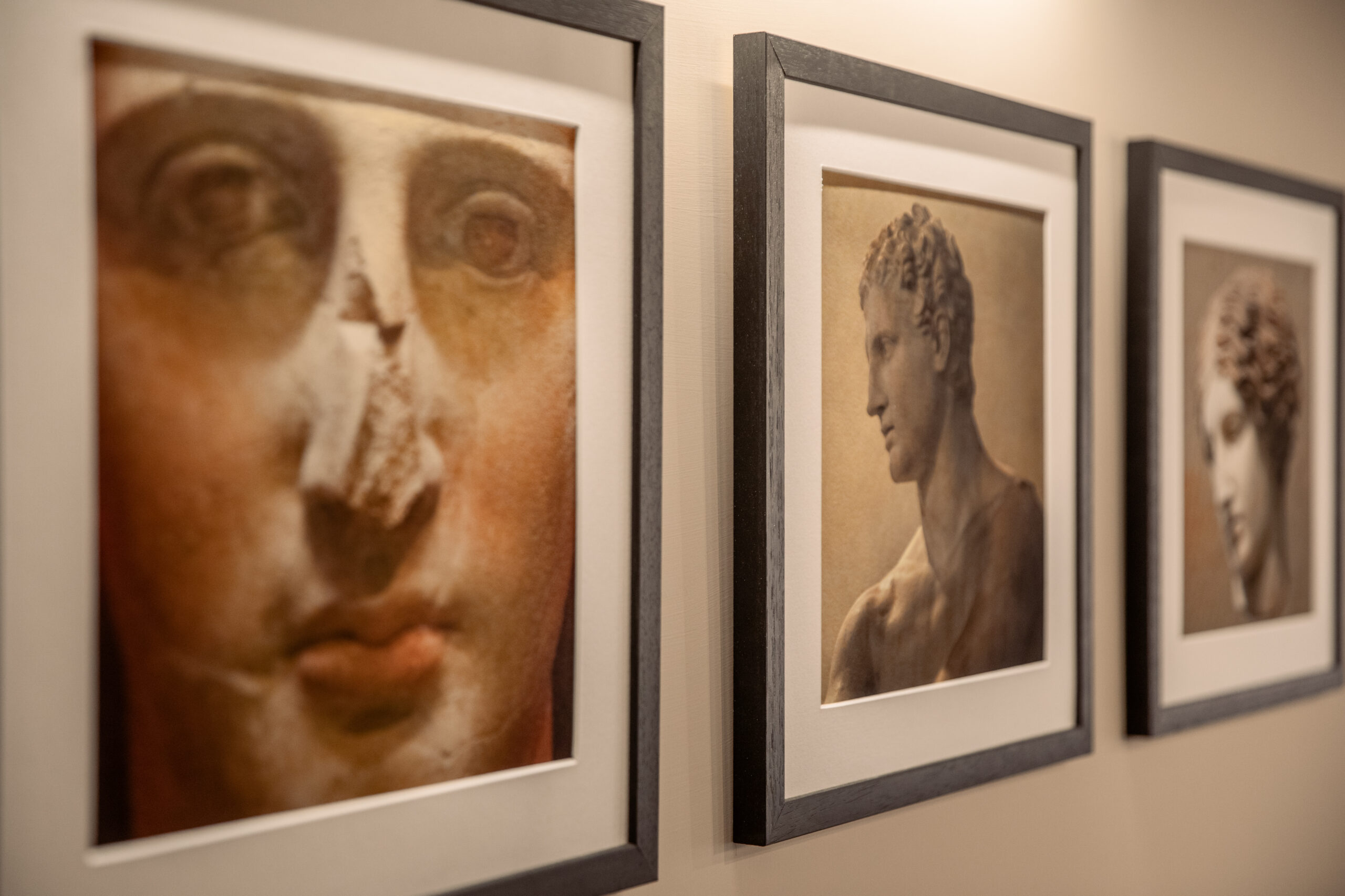 Framed artwork inspired by ancient Roman sculpture in a Rome apartment by Equity Residences