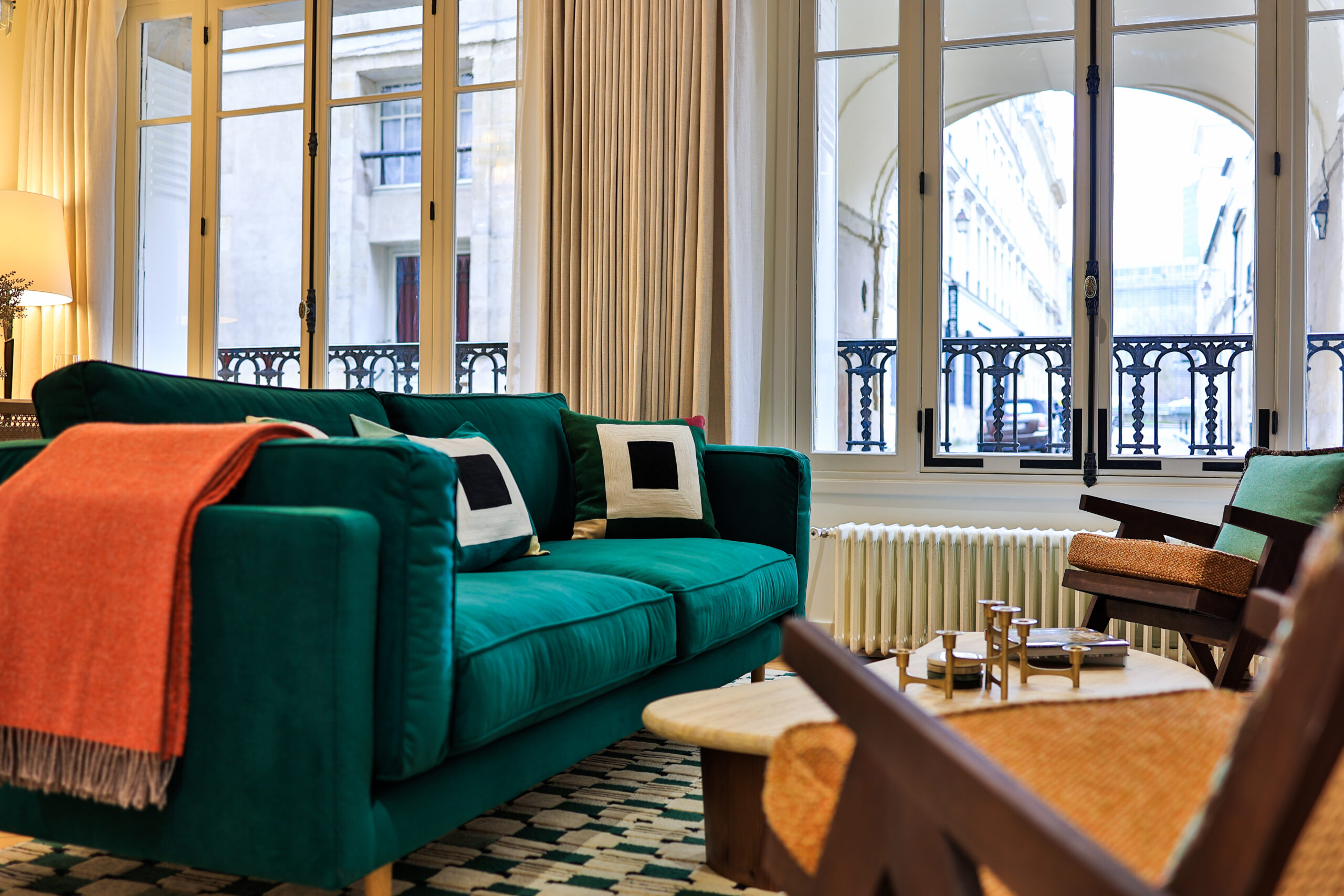 Elegant green sofa overlooking Parisian views in Apartment Île Saint-Louis, Paris