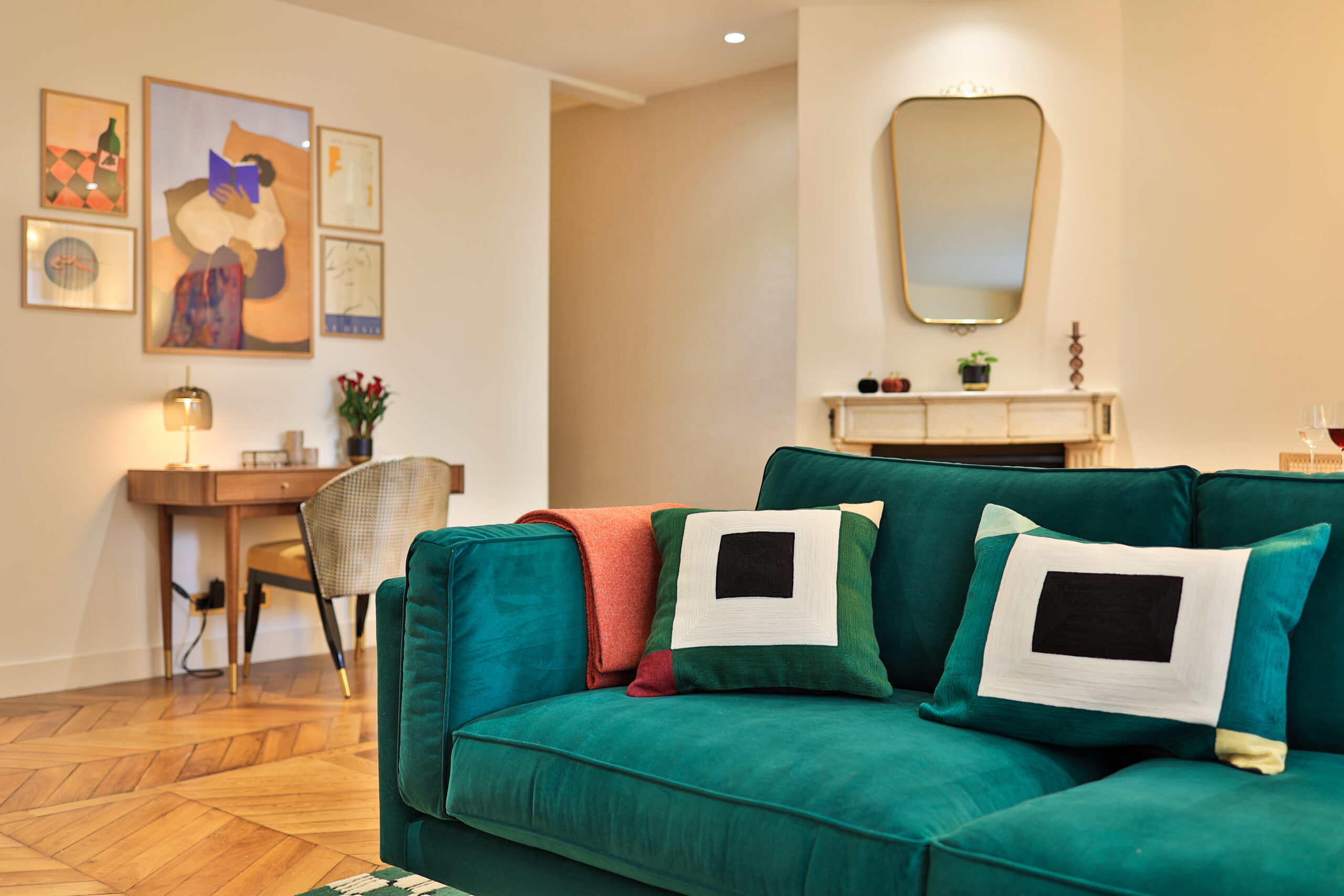 Elegant green sofa in the living room of Apartment Île Saint-Louis, Paris